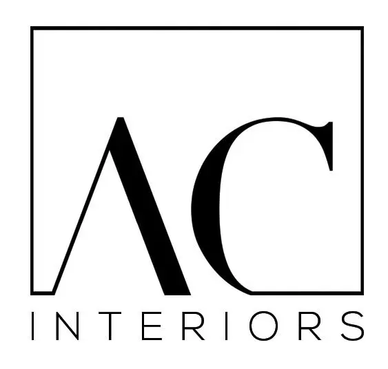 A black and white logo of ac interiors