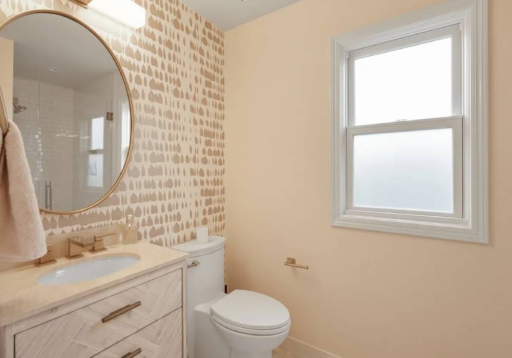 A bathroom with a toilet and sink in it