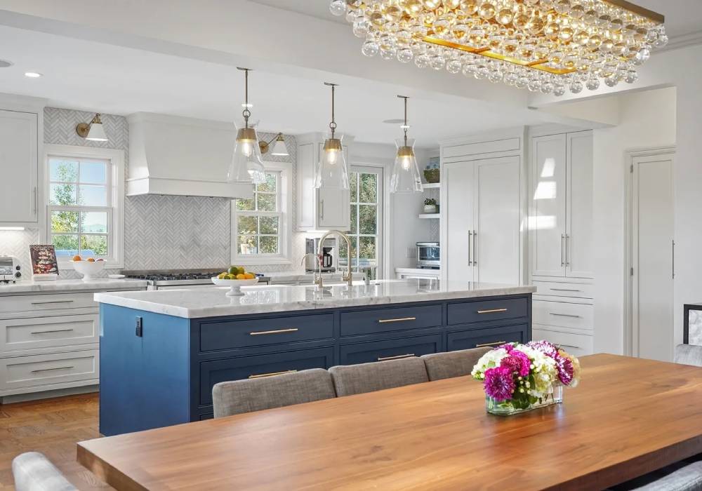 A kitchen with a table and chairs in it