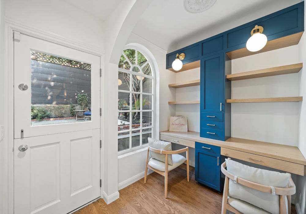 A room with blue walls and white trim.