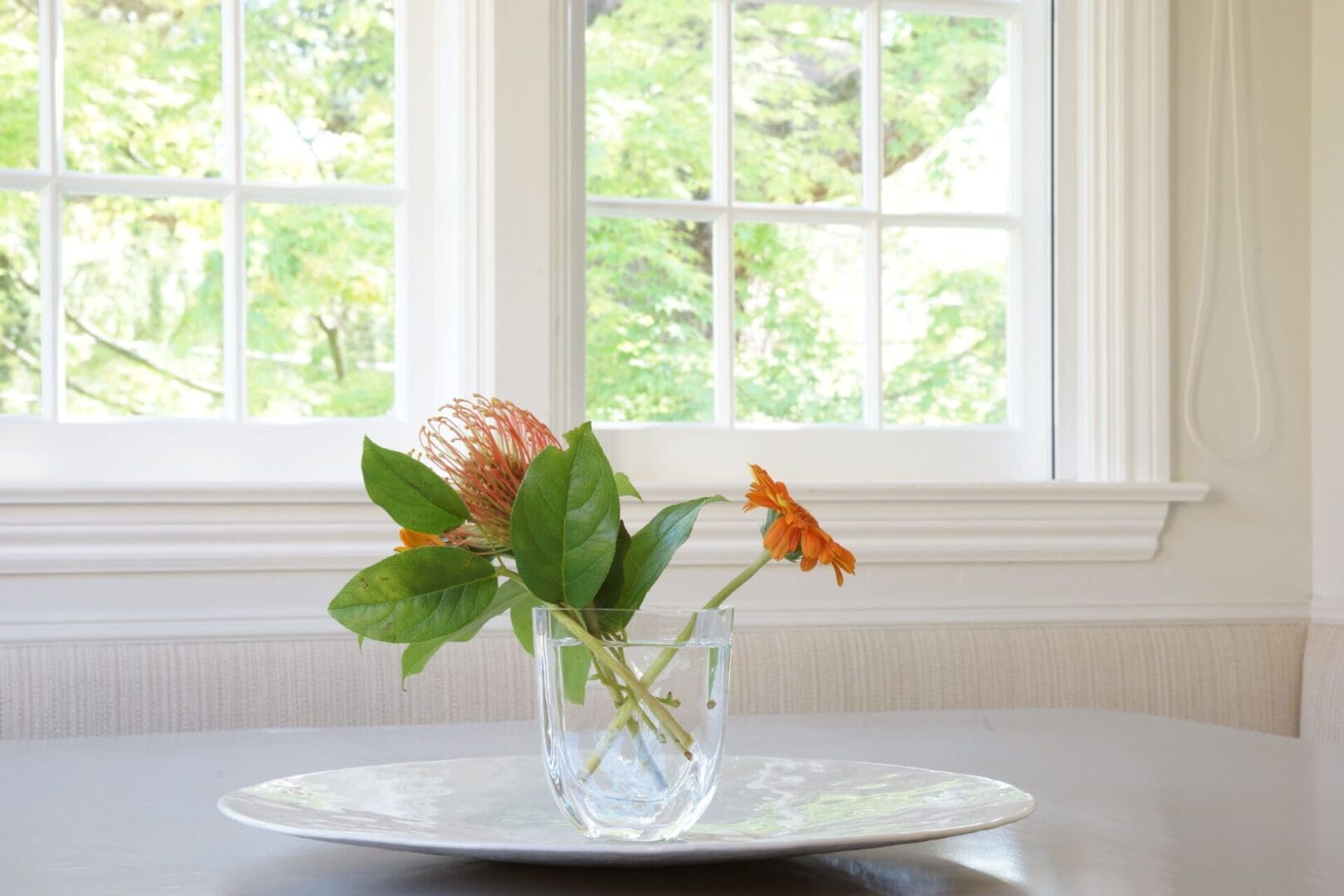 A vase with flowers on top of it