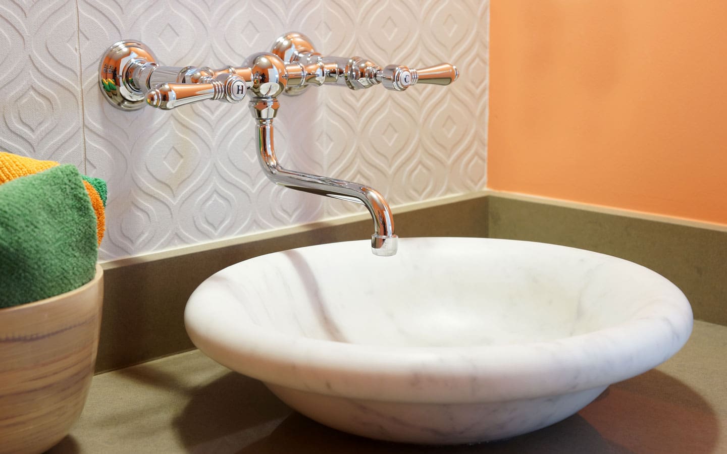 A white sink with a faucet in it