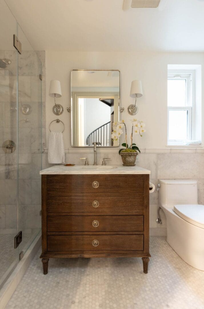 A bathroom with a toilet and sink in it