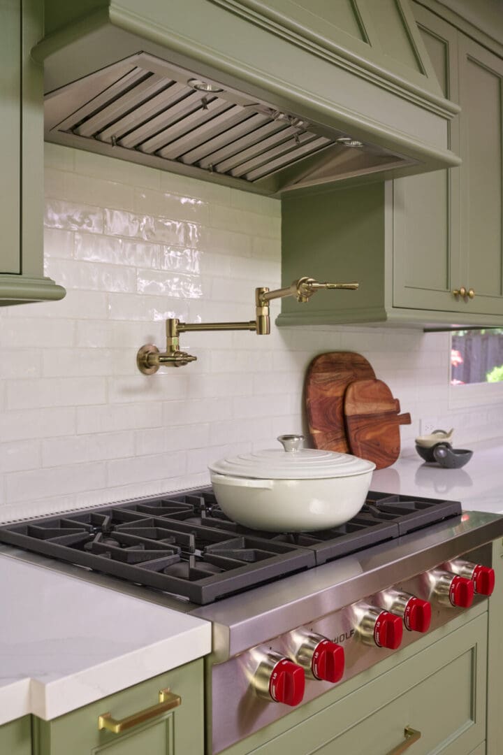 A kitchen with a stove and sink in it