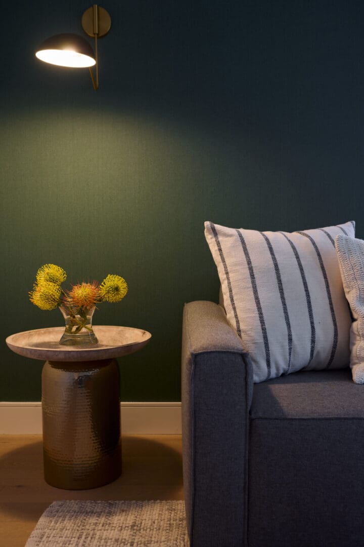 A living room with a couch and table